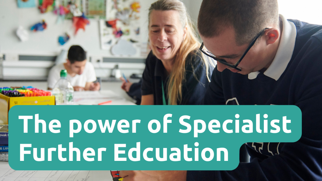 A young man is writing in a classroom while a teacher is looking and smiling at him. Text overlay reads "The power of specialist further education"