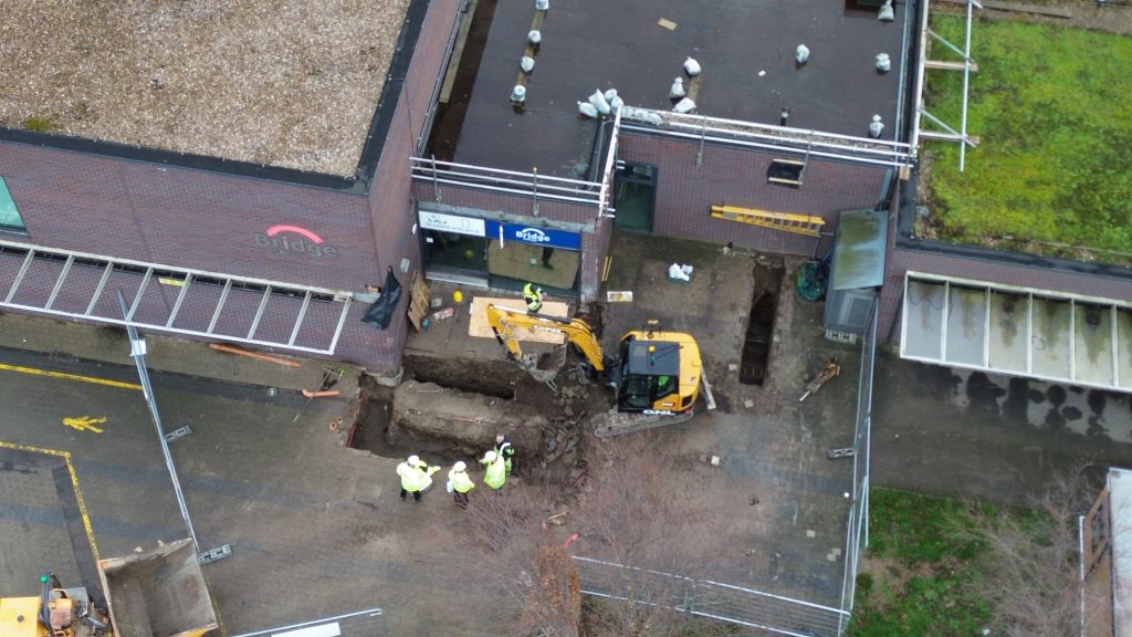 an aerial photo of a digger working on the expansion project at Bridge College