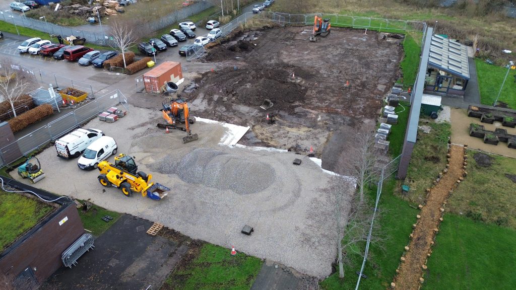 an aerial photo of the Bridge College car park with building work being done