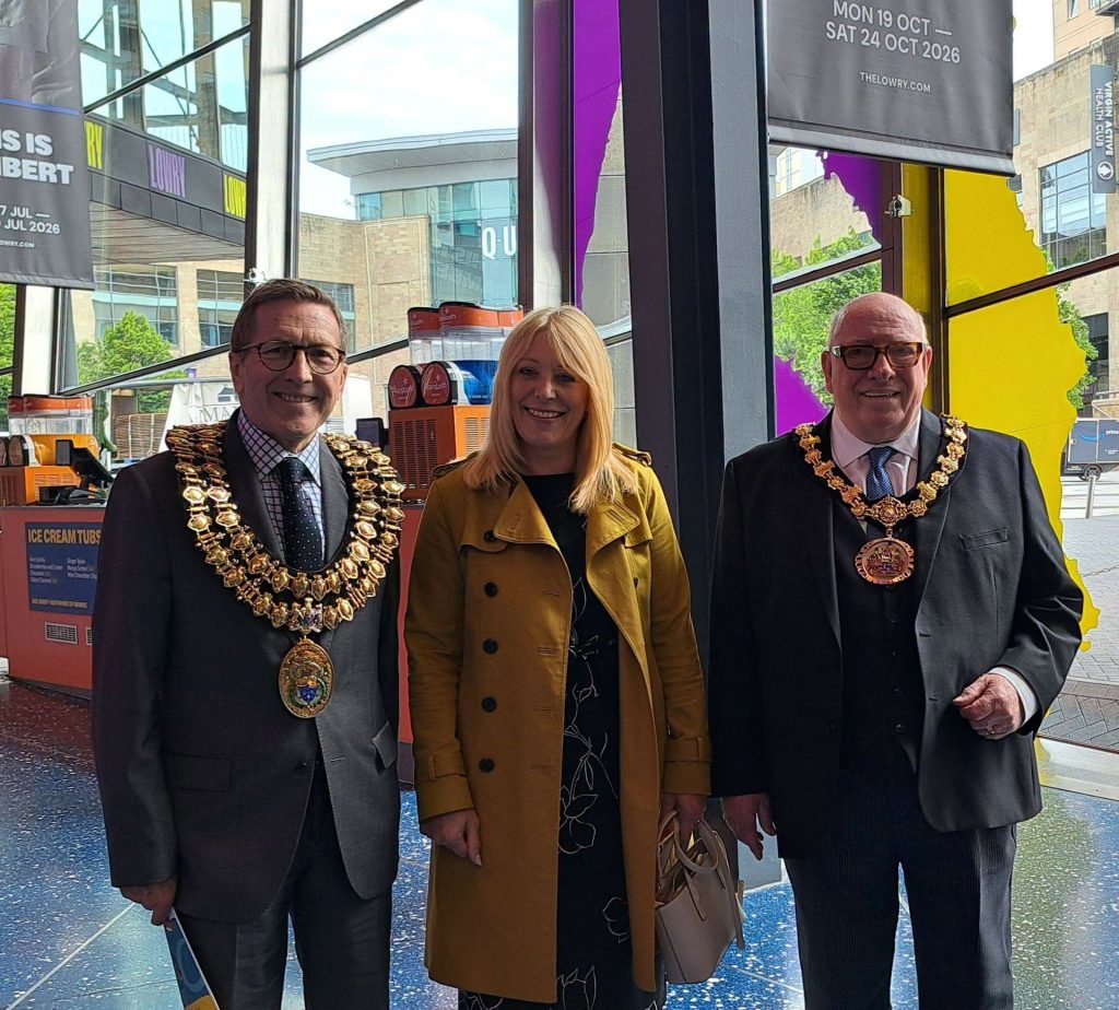 Two mayors standing next to Mel Dunn, the Together Trust CEO.