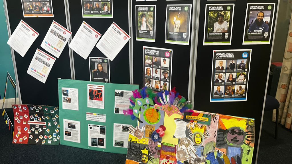 Art work and posters on display at a Black History Month event.