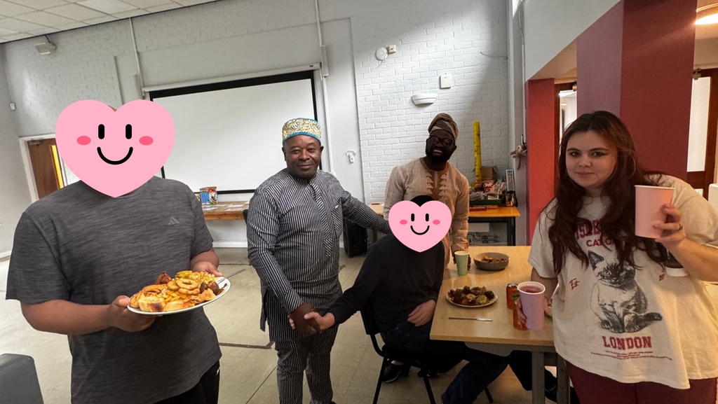 Salford Hub colleagues and people they support enjoying the buffet