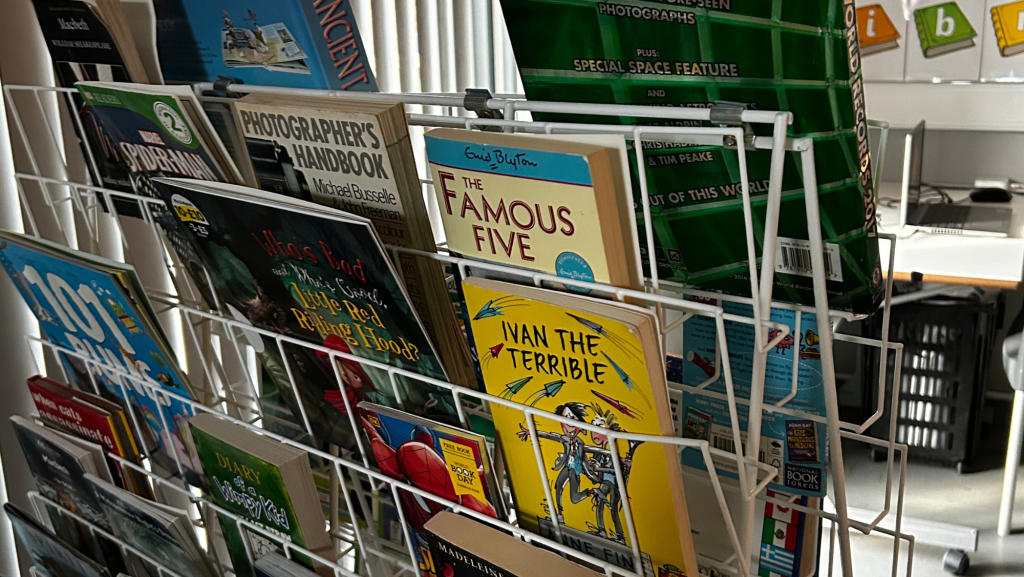 A photo showing some books on a stand