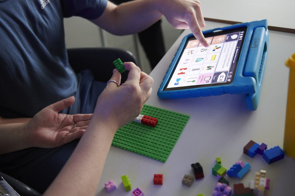 a student's iPad showing speech icons to aid with speech