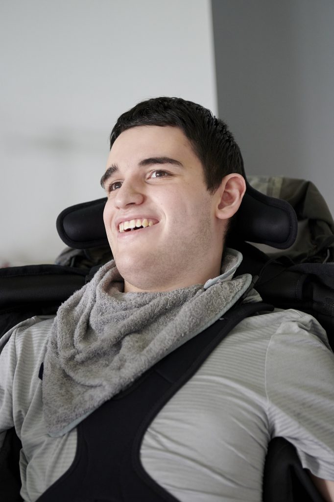 a Bridge College student smiling