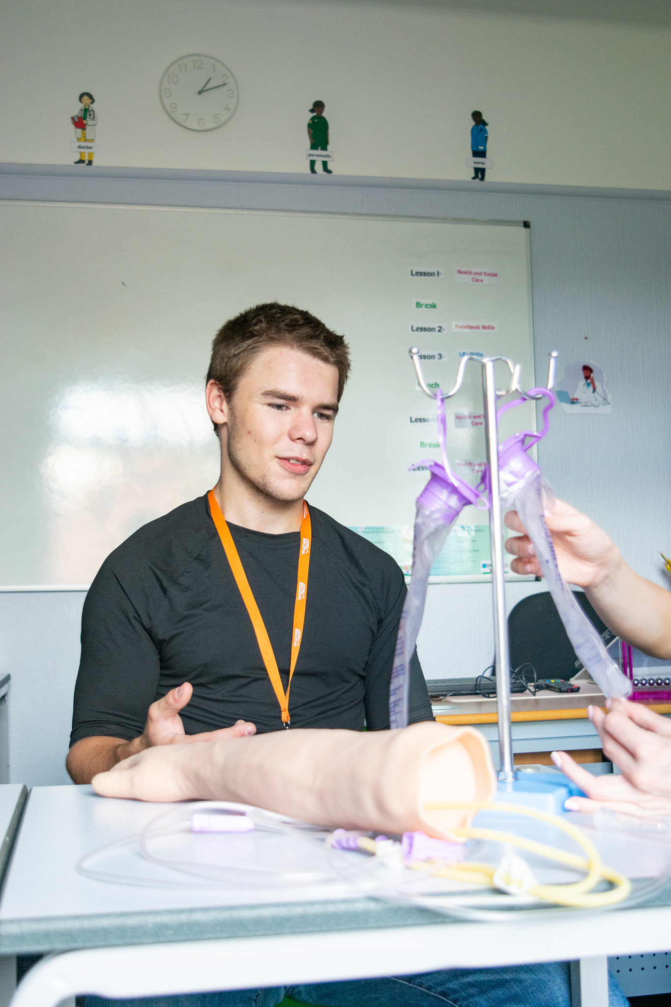 a college student working with a model of a medical apparatus